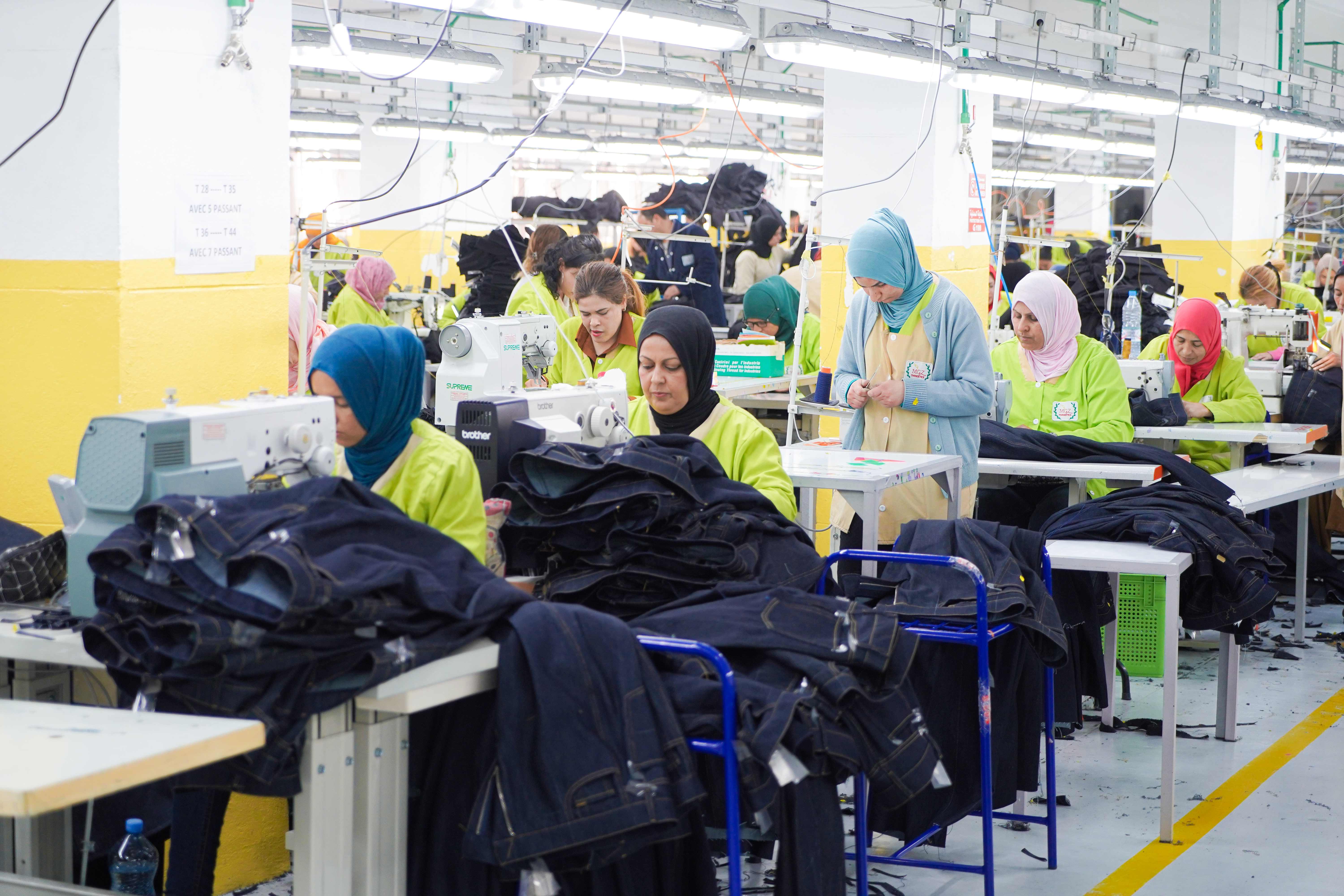 Threetex production team working on garments with precision